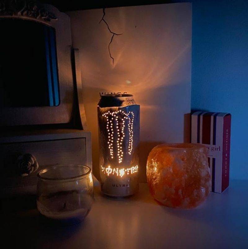someone made a candle out of a monster can