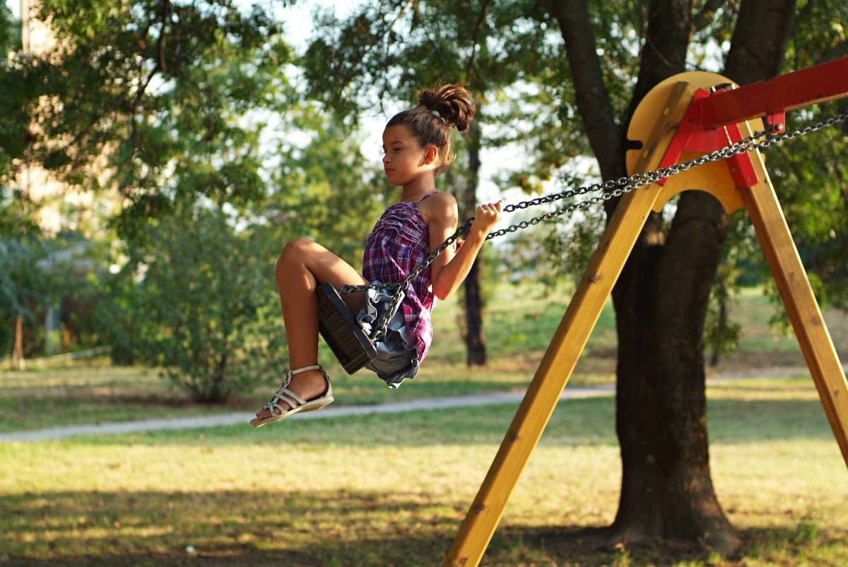 Little Girl On A Swing