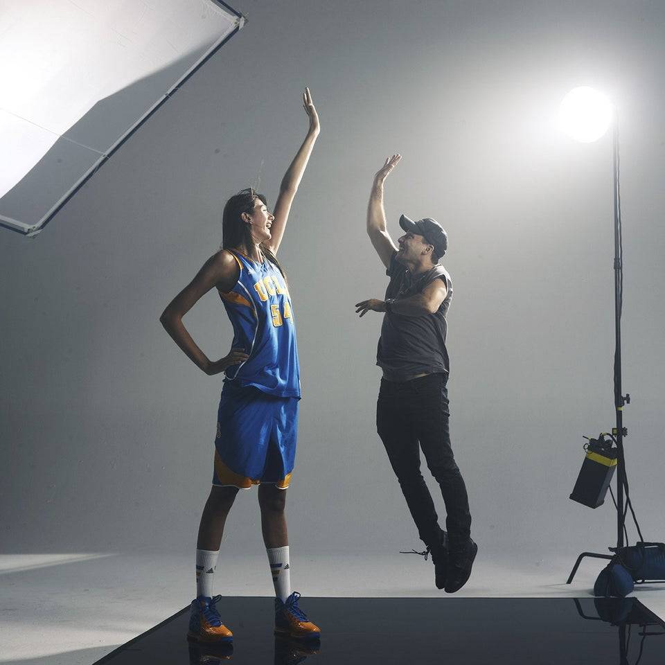Basketball player high fives man in Photoshoot