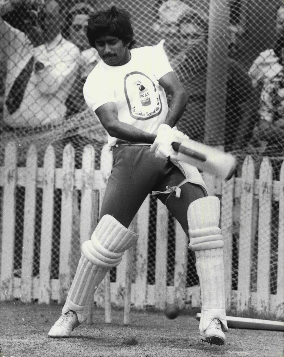 Javed Miandad bats during a cricket game.
