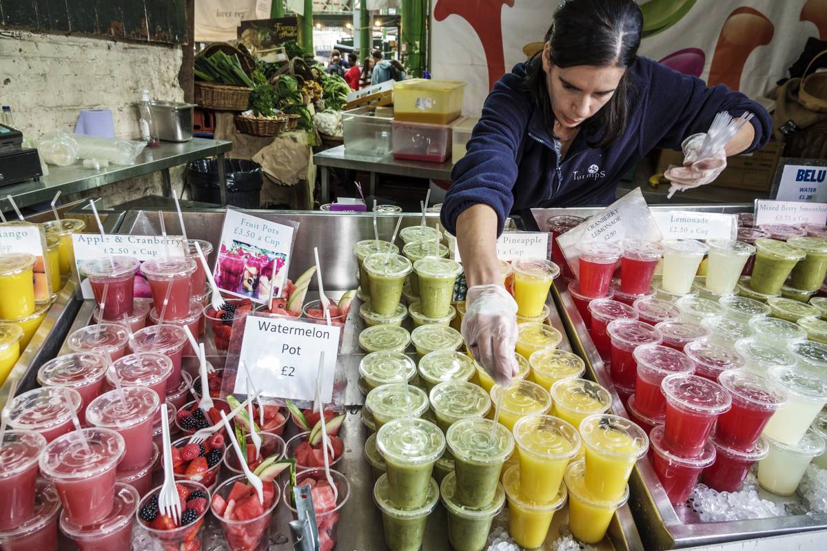 A vendor in London sells fresh juice.