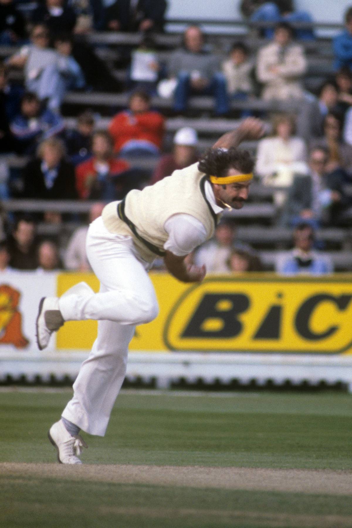 Dennis Lillee throws a ball.