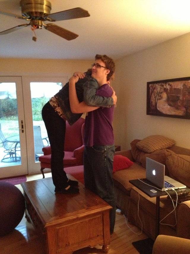 Mom Hugs Her Son From The Table Down