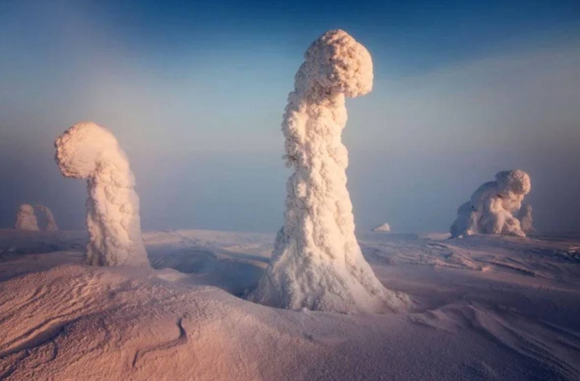 icy pillars rising from snowy ground look like something from a sci fi film