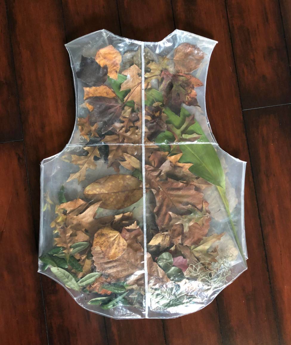 vest is see through and filled with leaves