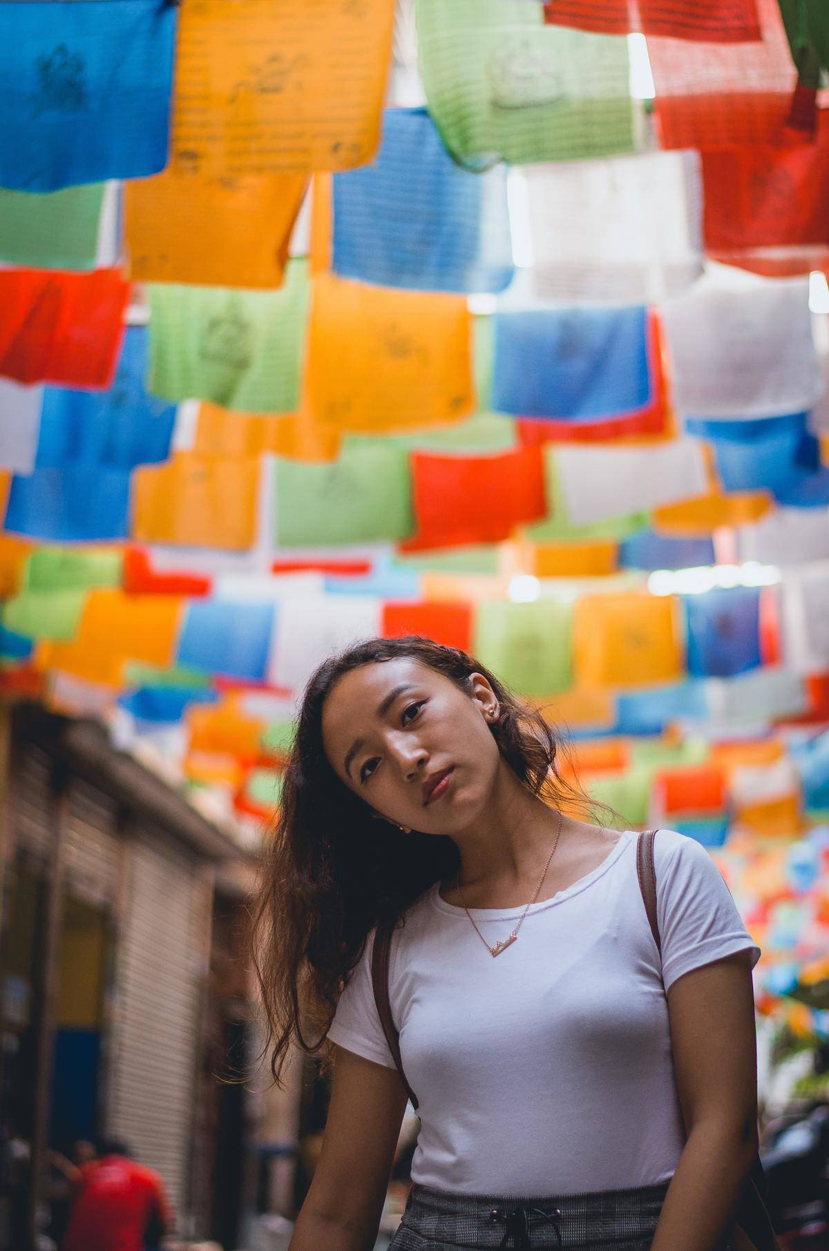 woman tilts her head in the street