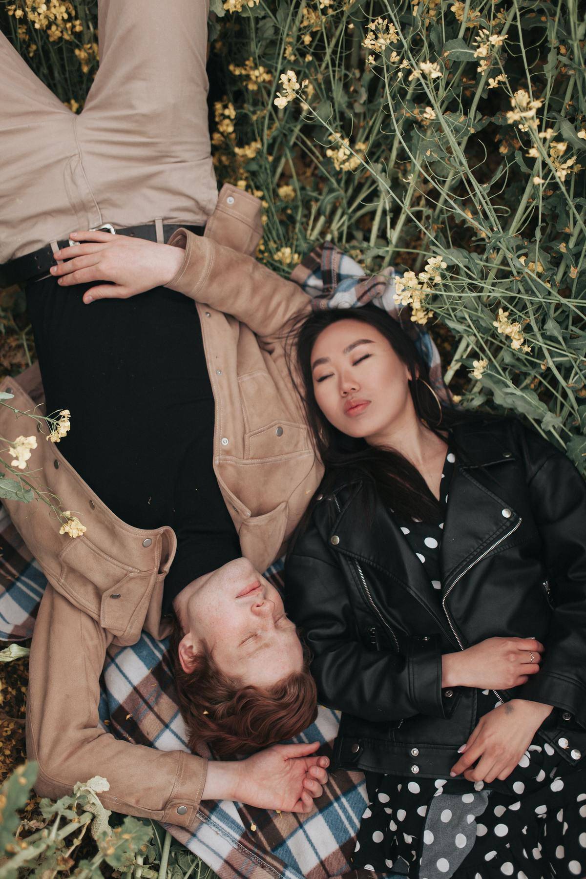 couple lying down in the grass