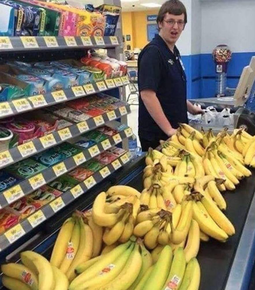 conveyor belt at walmart checkout covered in bunches of bananas