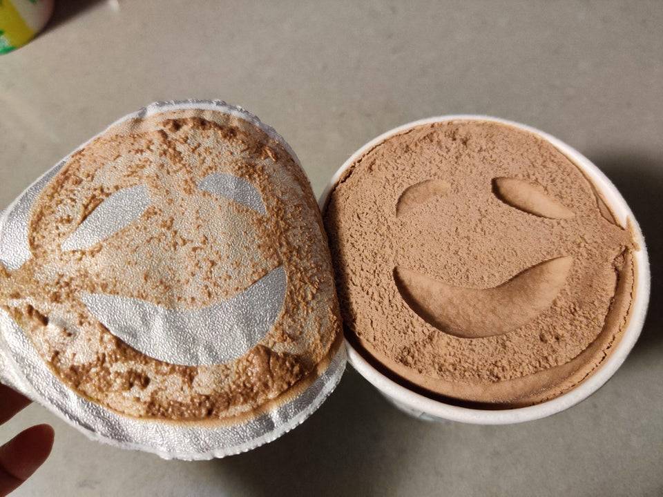 chocolate ice cream that looks like it is smiling 