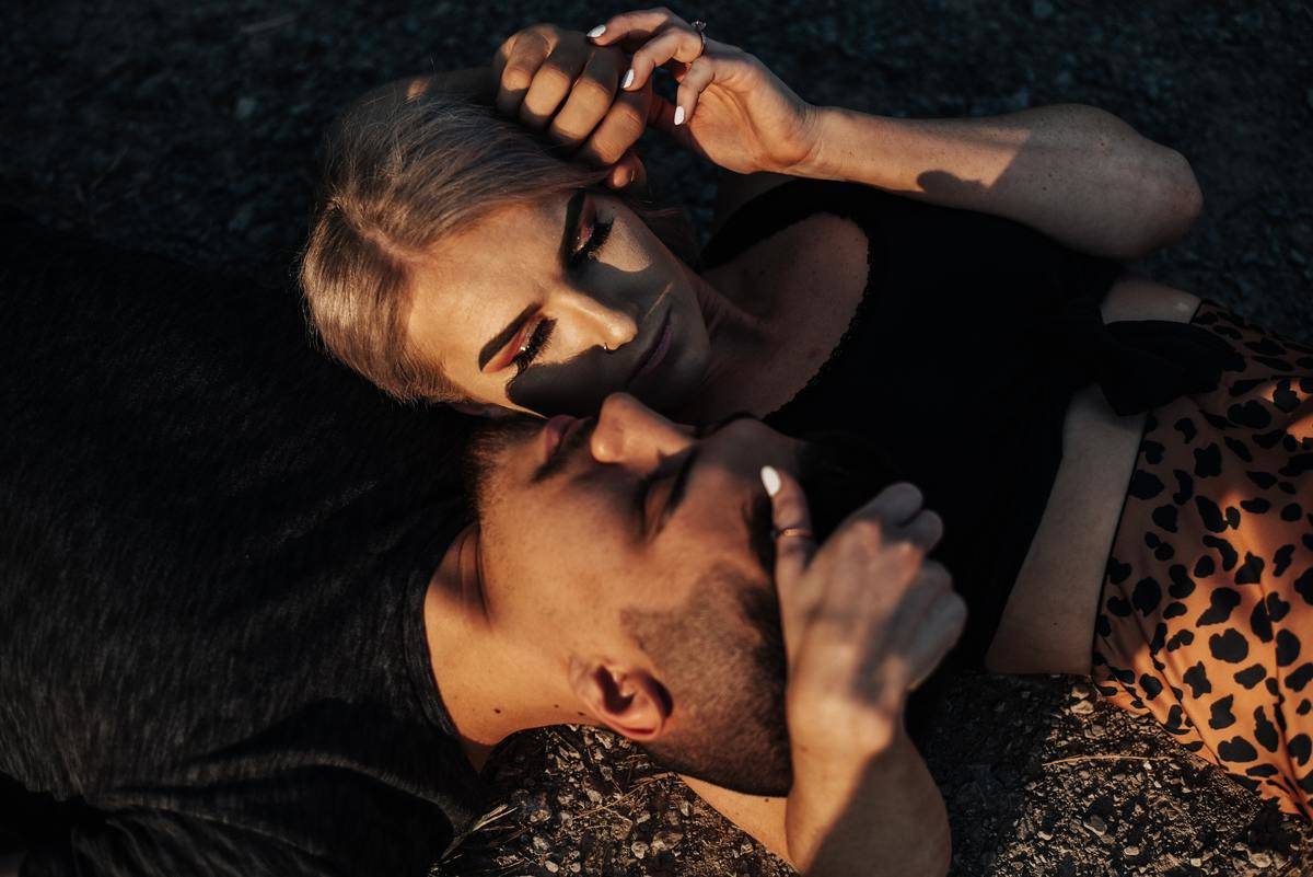 a couple cuddling on the ground