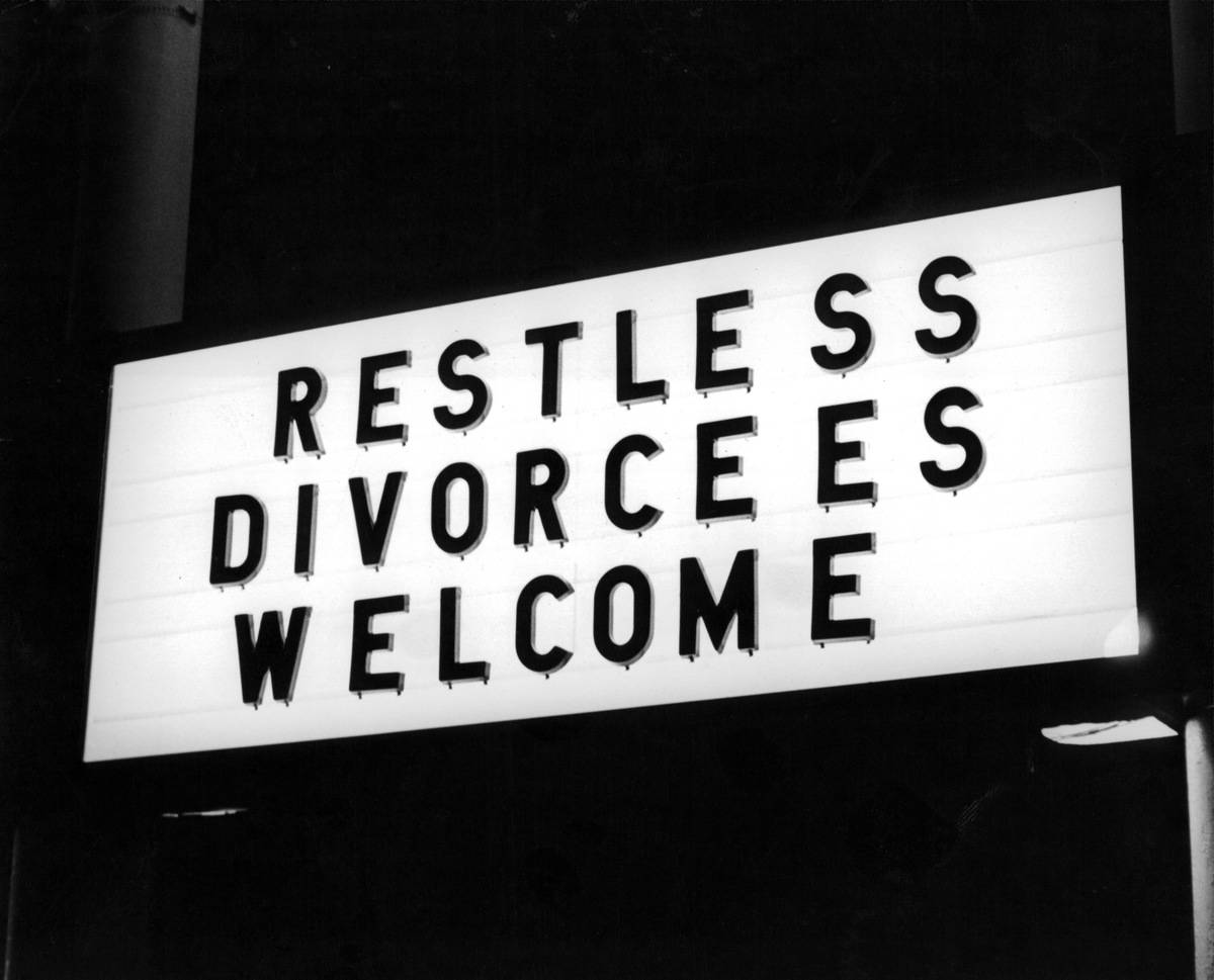 sign reads: Restless divorcees welcome
