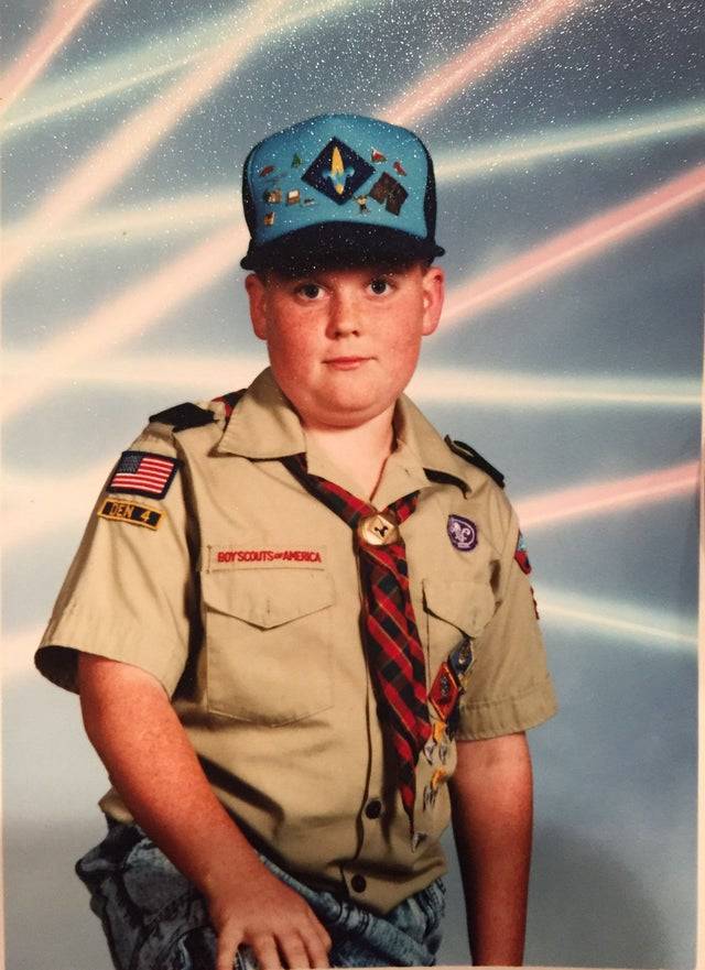 kid wearing a boy scout hat