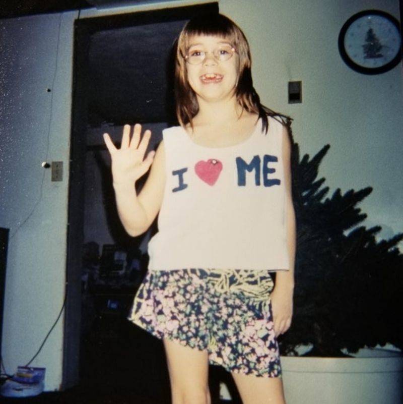 a girl wearing an I heart me tshirt