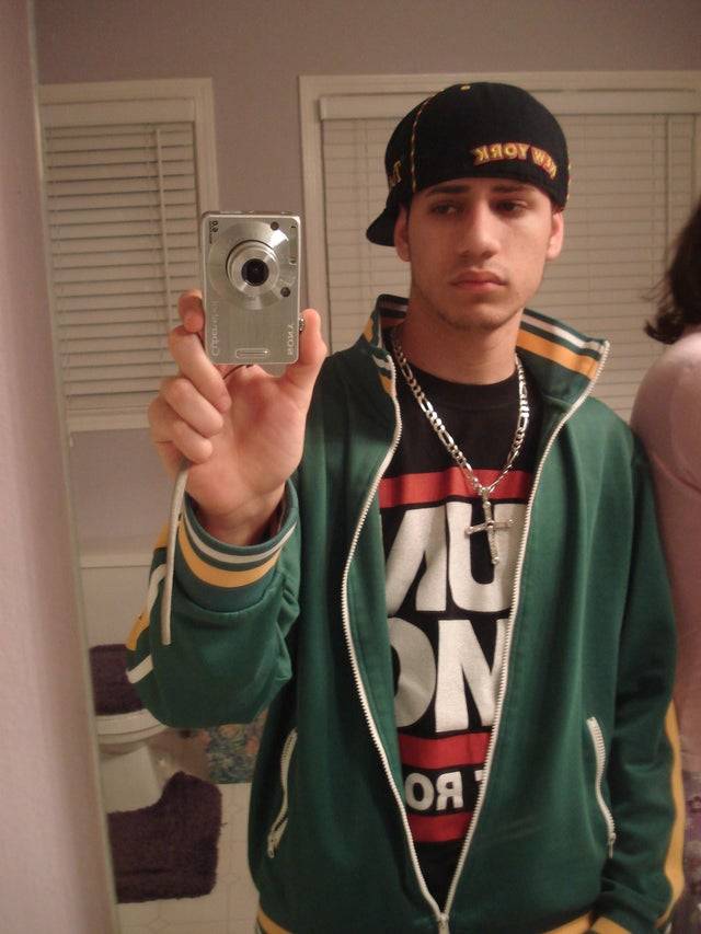 guy taking a selfie trying to look like a gangster