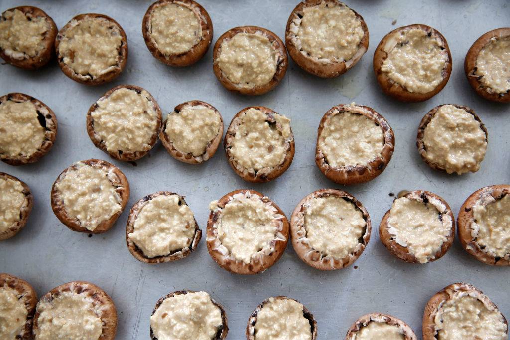 stuffed mushrooms scattered on a table