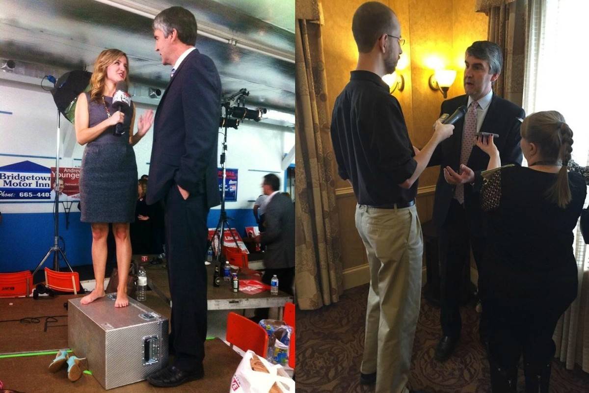 two reporters interview tall politician