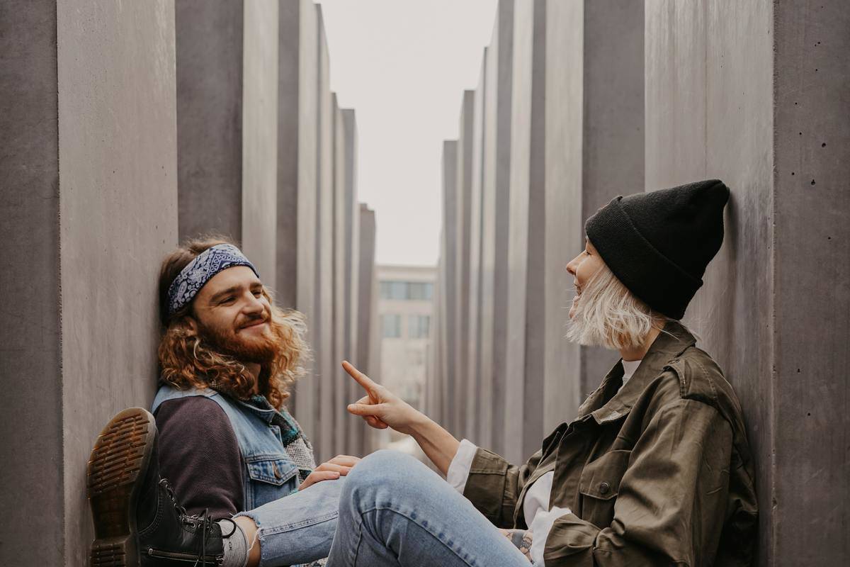 couple sitting around some rocks