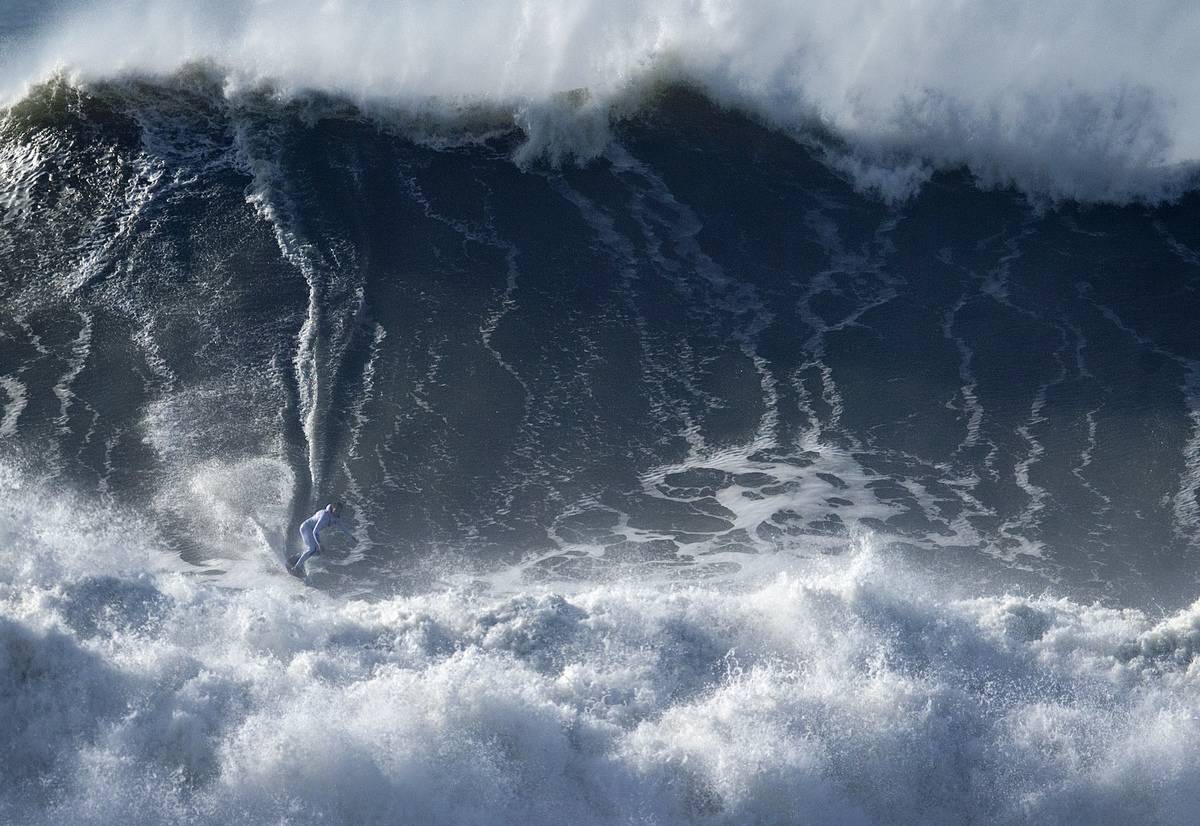 Big Wave Surfing by an extreme athlete