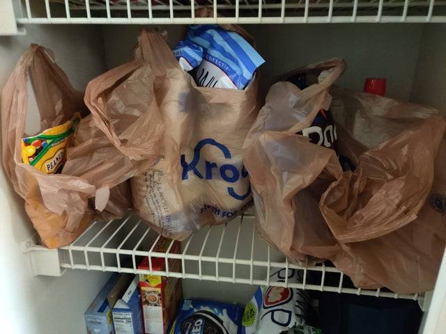 full grocery bags in pantry