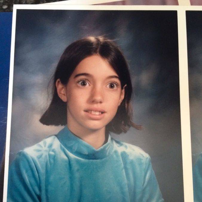 school photo of girl with eyes very wide
