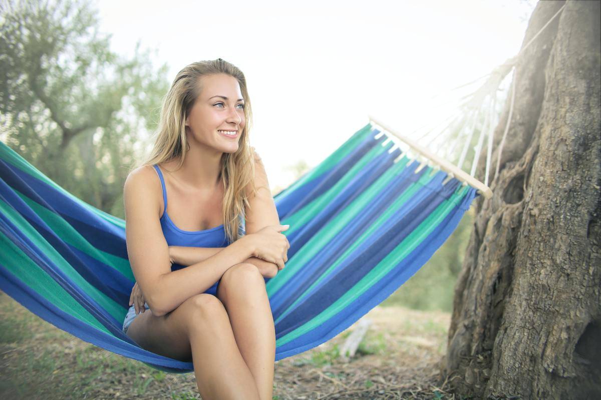 woman seated on hammock