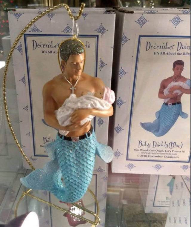 merman holding a baby ornament 