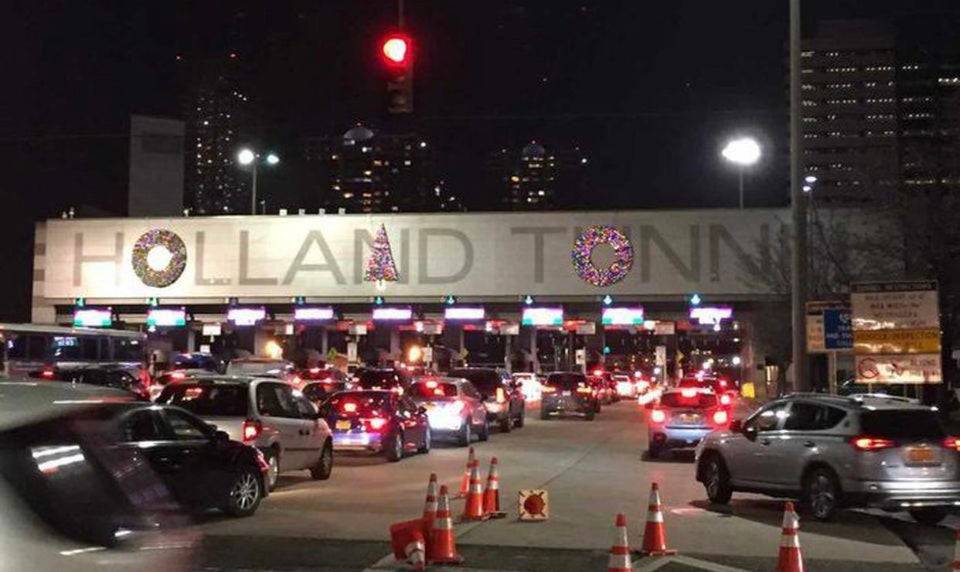 holland tunnel decorated for christmas with decorations over letters that they look nothing like.