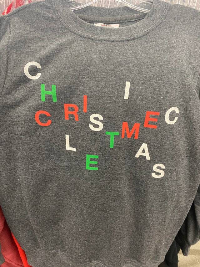Sweater with letters jumbled on it