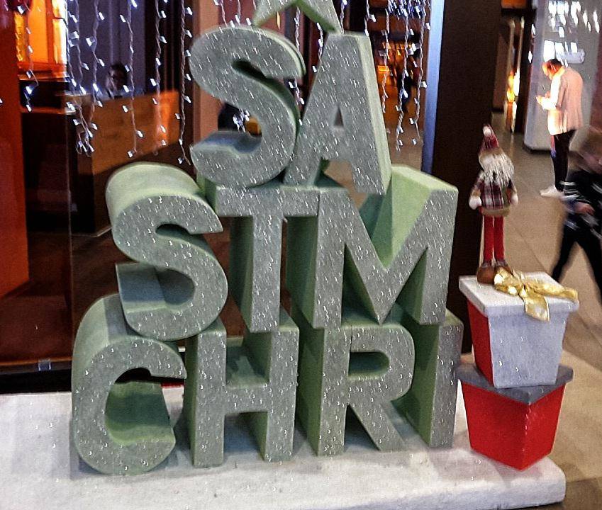christmas sign, word split up backwards