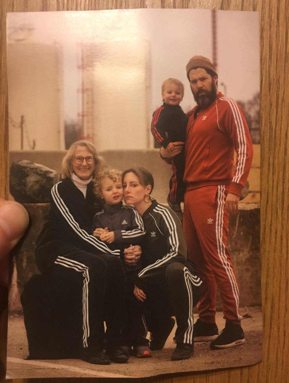 christmas card with entire family in adidas tracksuits with the stripes on the sides