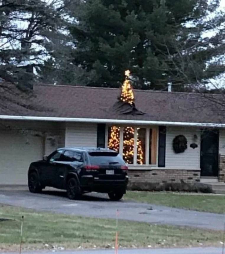 christmas tree breaks through roof of house