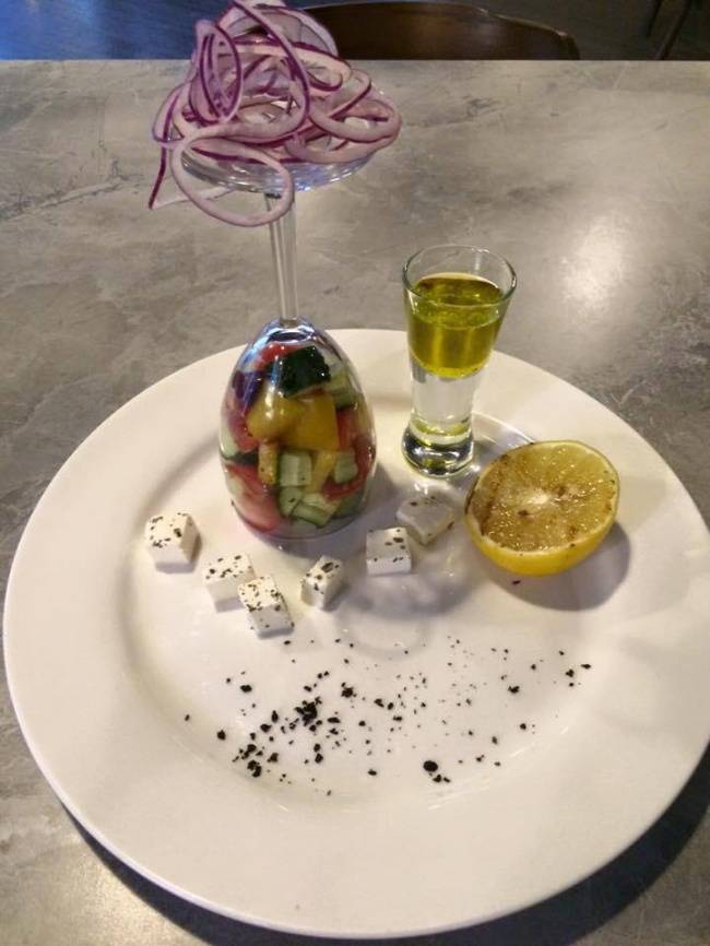 fancy salad inside wine and shot glasses