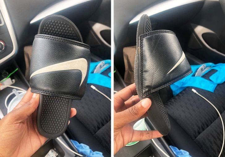 Person holding Nike flip-flop that has shrunk smaller than their hand