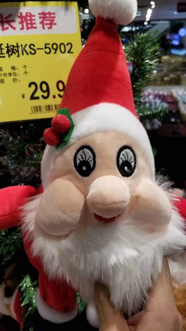 santa plushie with strange eyelashes that come out of his irises.