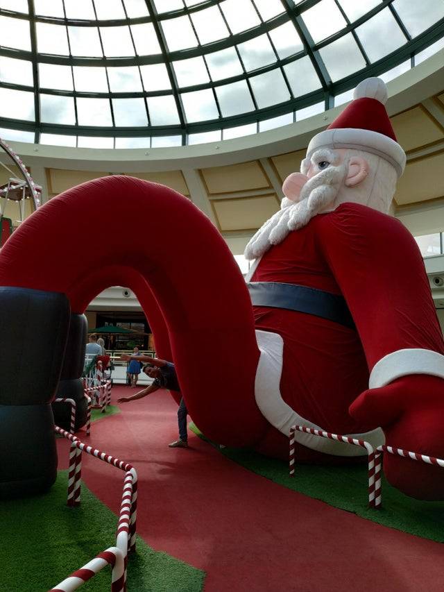 goofy blow-up Santa, entrance between legs