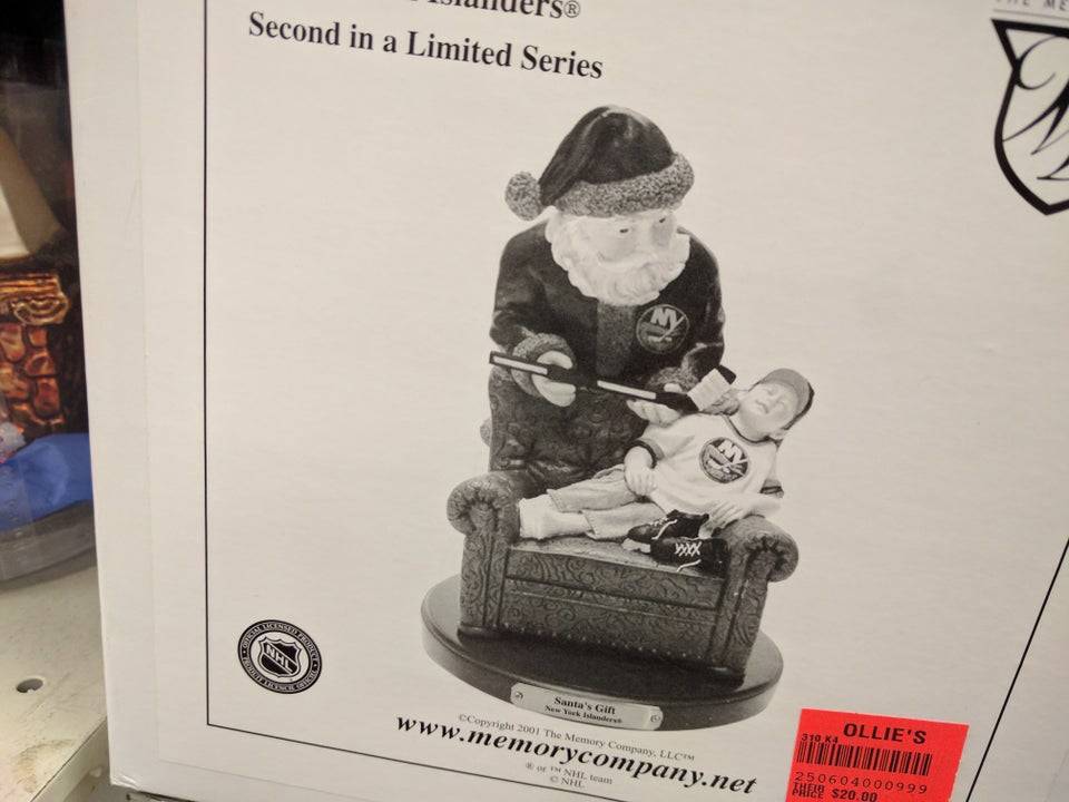 picture of Santa bringing a boy a hockey stick in his sleep