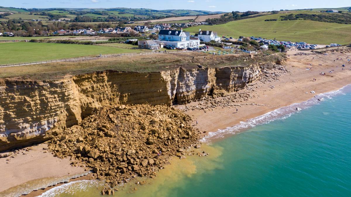 Sandstone cliffs collapse along Jurassic Coast, England.
