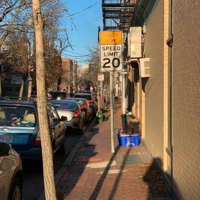 speed limit sign on sidewalk