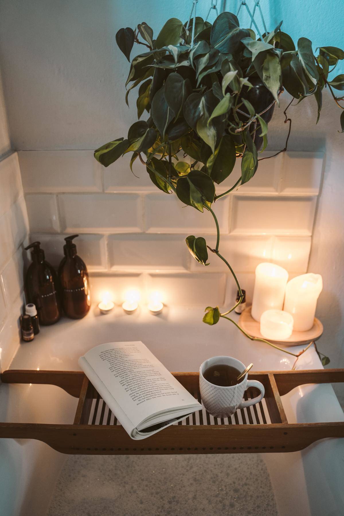 a really nice bath set up with candles and a book