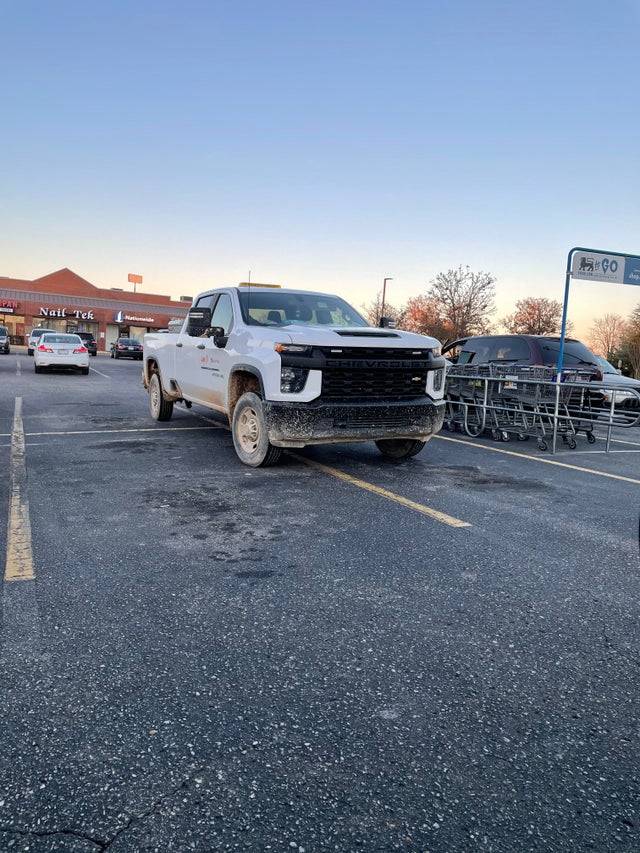 truck parked in four parking spots