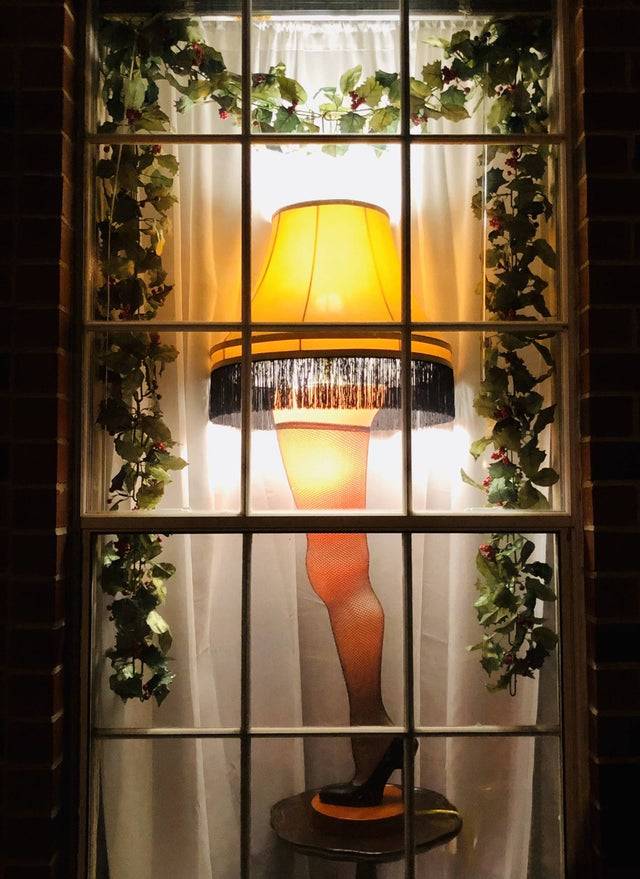a christmas story leg lamp in front window