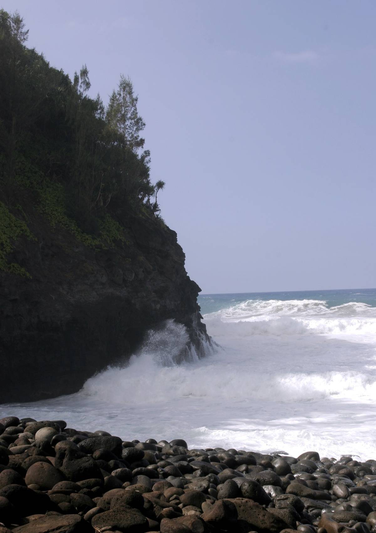 Treacherous waves crash on the beach of Hanakapiai, Kauai.