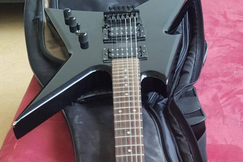 old electric guitar in the case