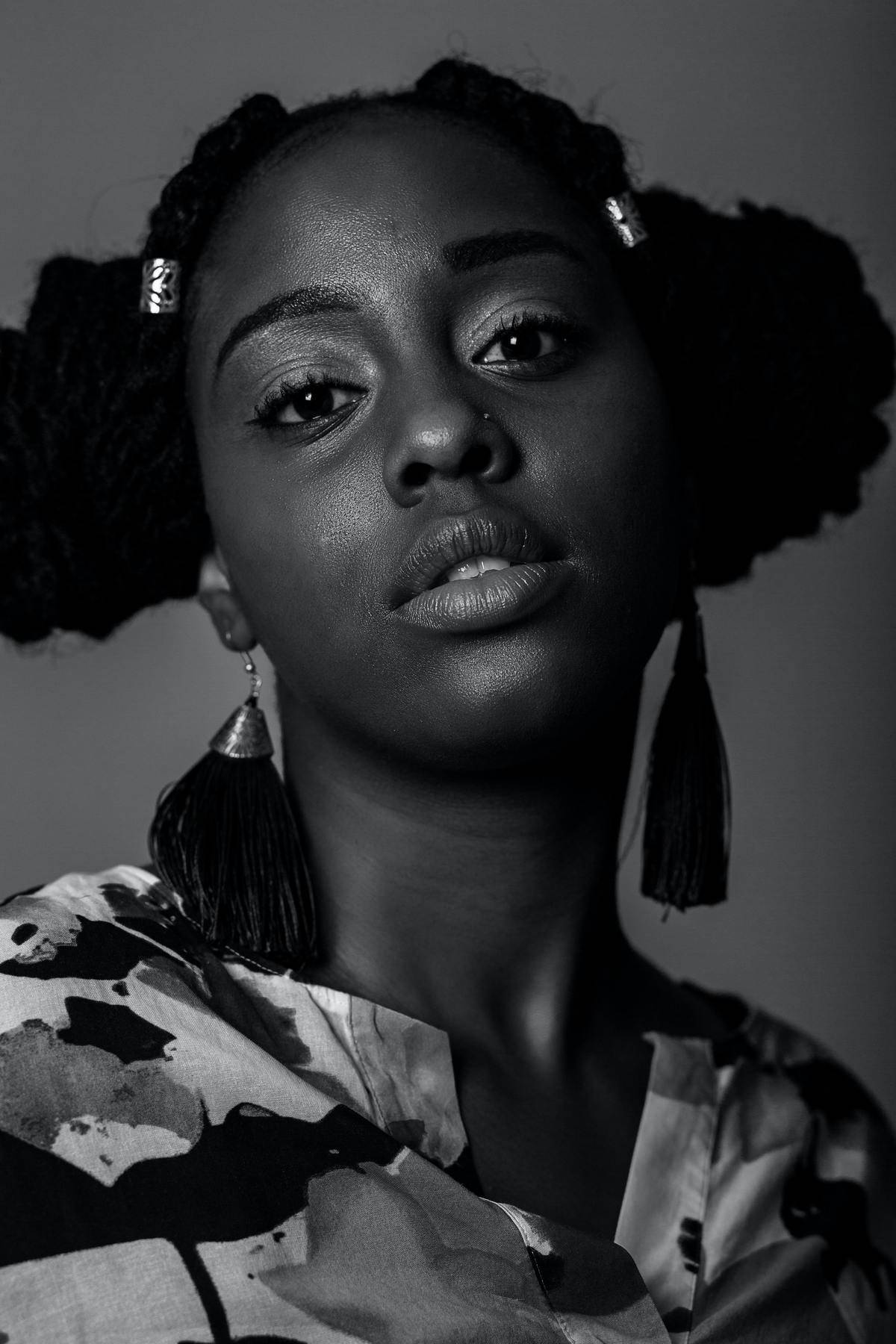 a fierce looking woman looking at the camera