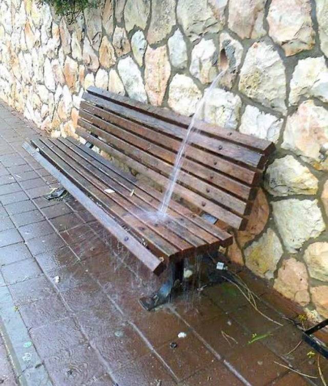 bunch under water spout in wall