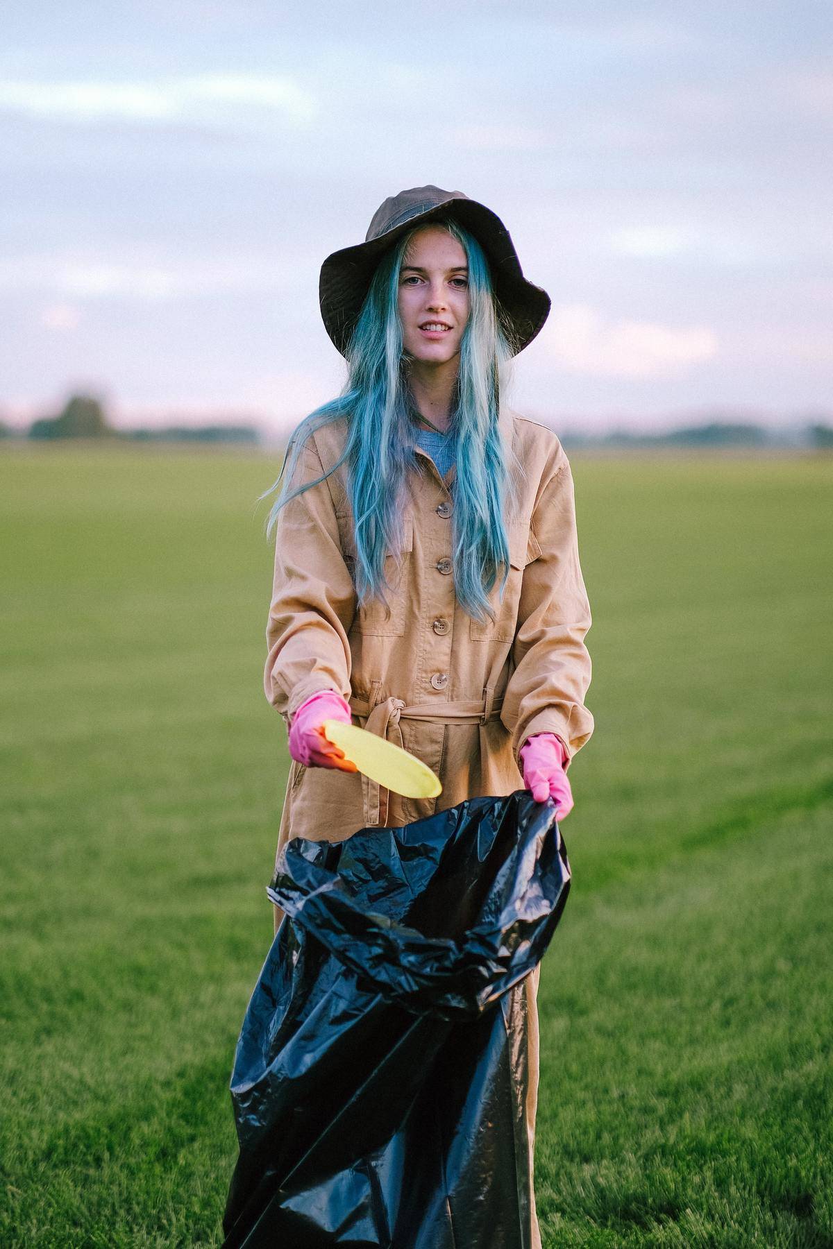 woman picking up garbage