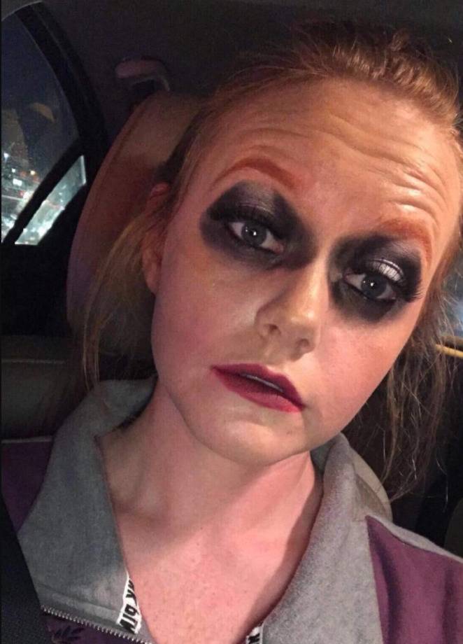 woman with black raccoon eyeliner circles