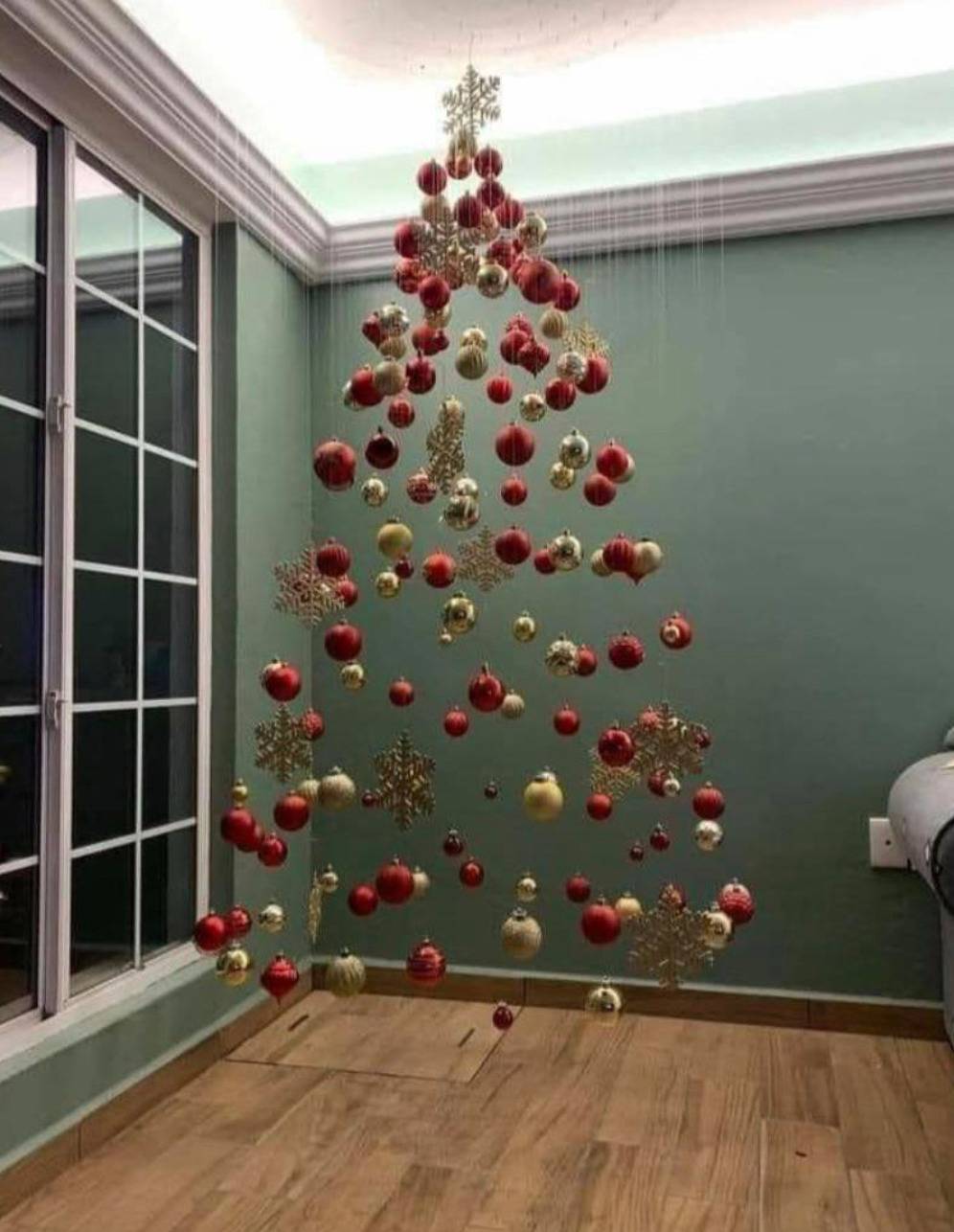 ornaments hanging from strings look like they're decorating an invisible tree