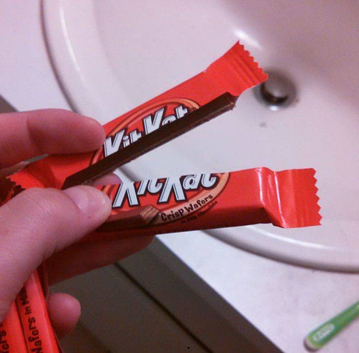 kit kat broken perfectly in half with chocolate intact