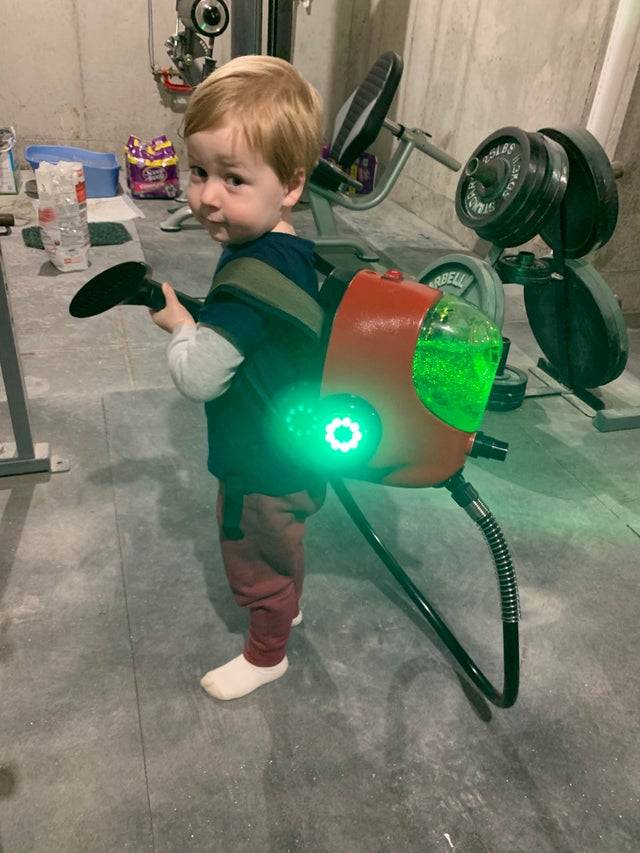 Kid carrying vacuum like Luigi's haunted mansion